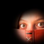 scared girl with a book